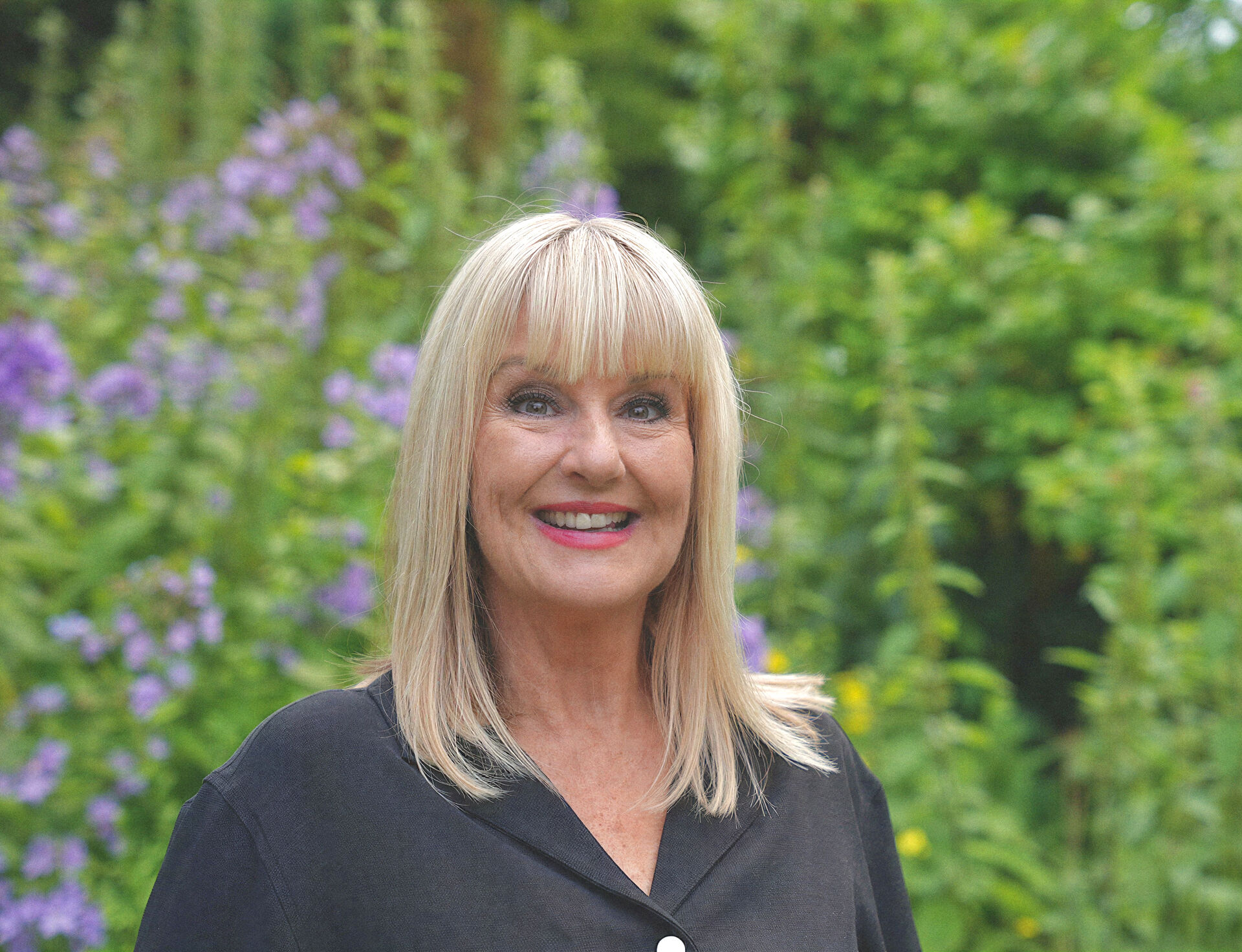 Helen Cassidy in a summer garden